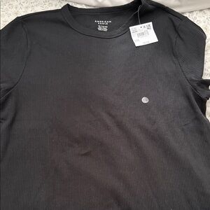 American Eagle black tee.